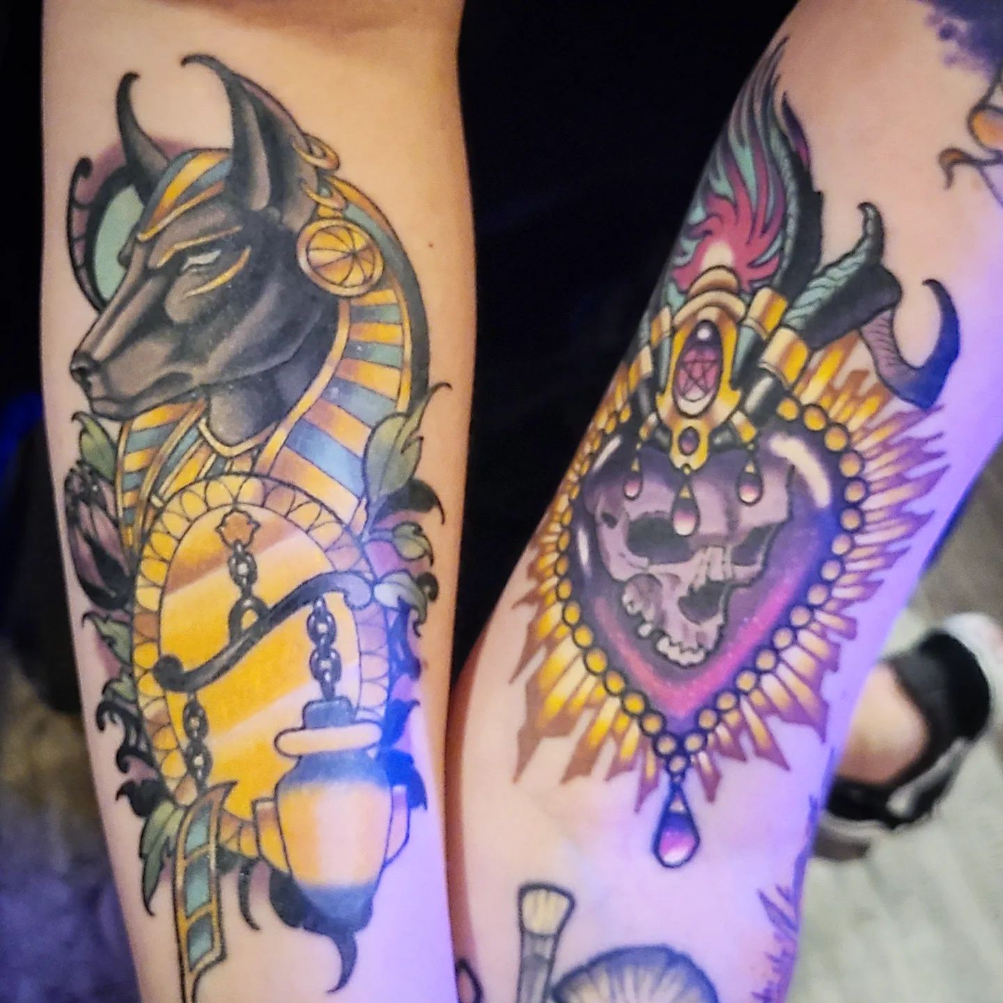 An Anubis tattoo with cartoon vibes.