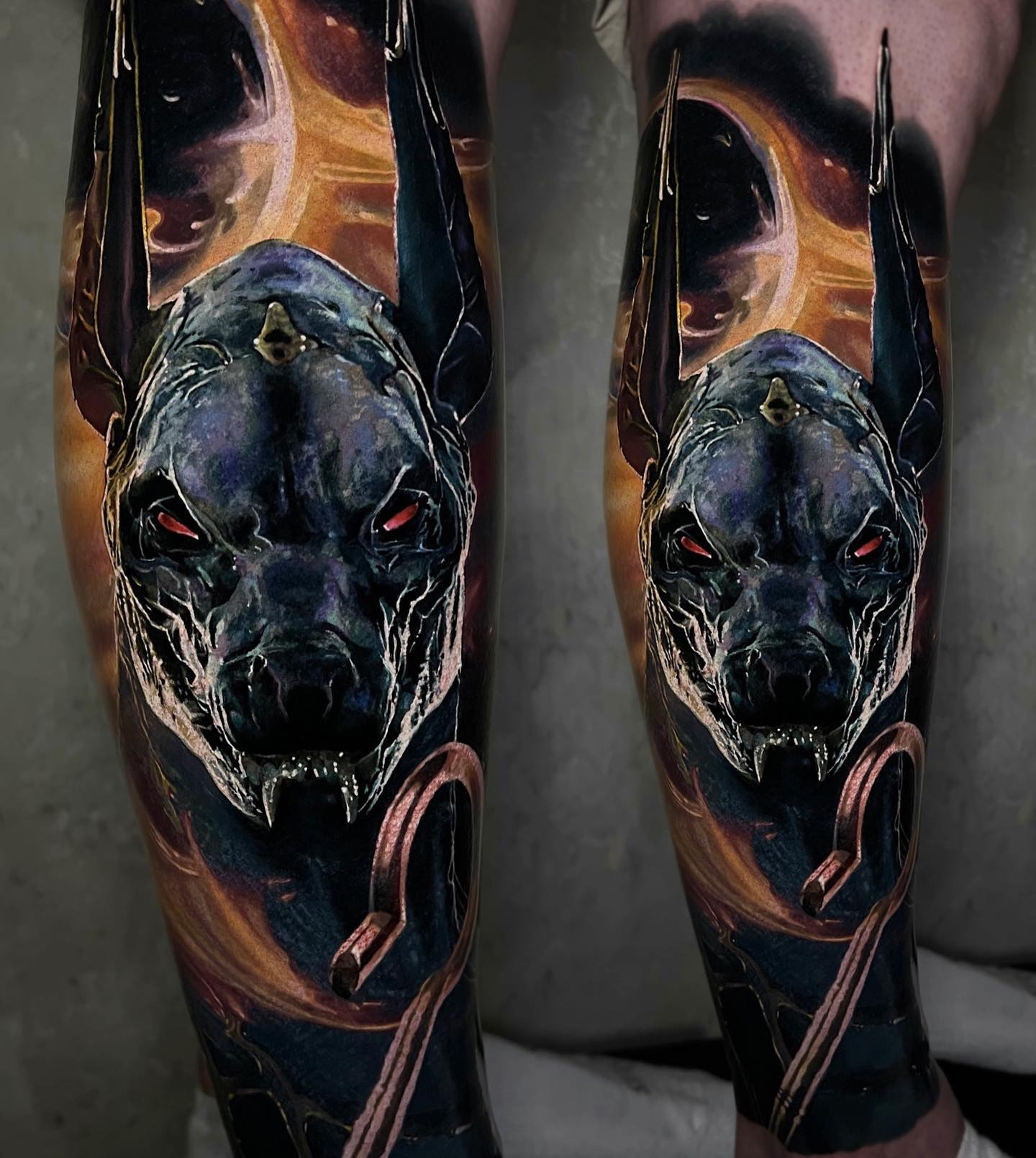 A perfect Anubis Tattoo on calf.