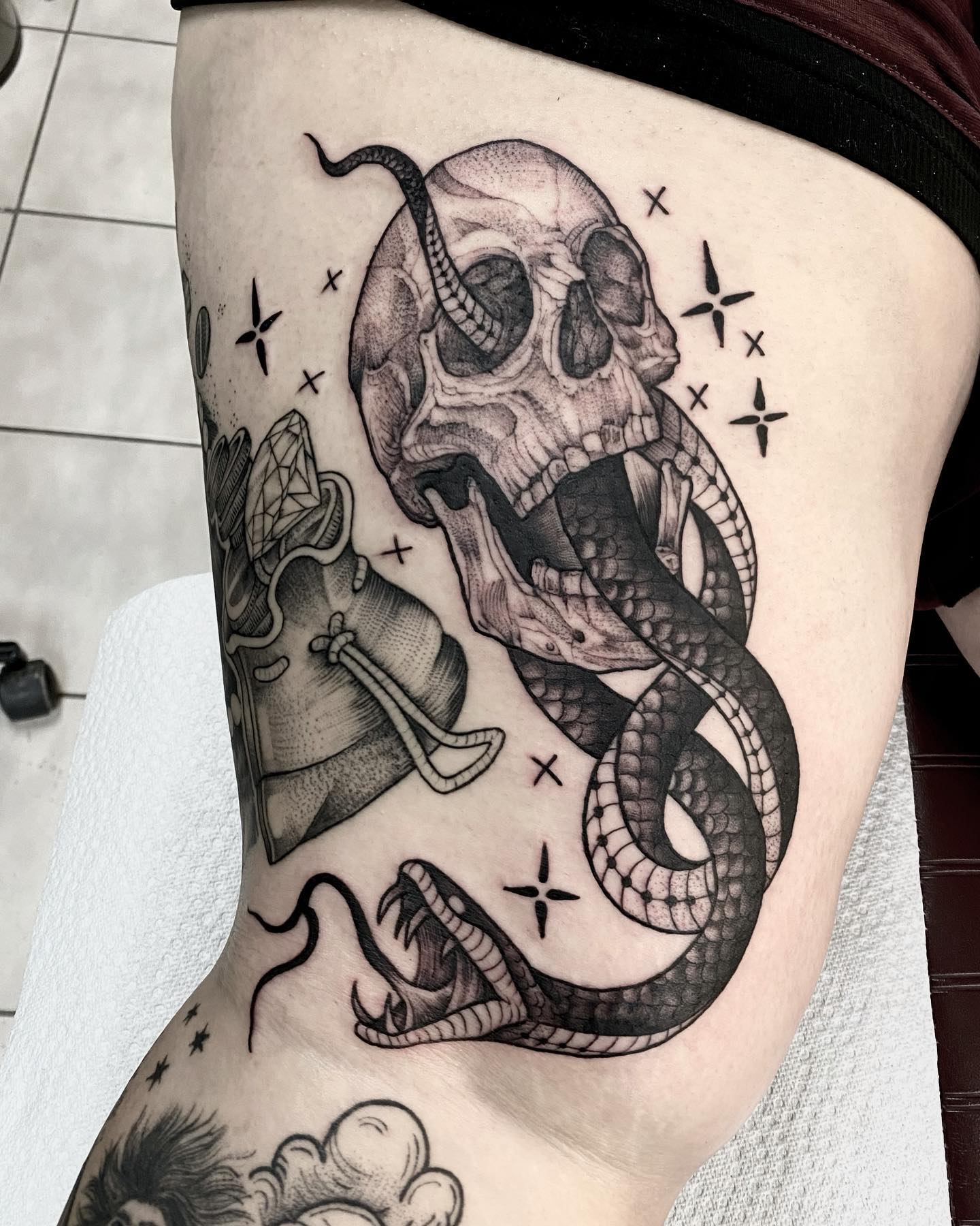 Here is a great option if you want to get a tattoo and want it to be heavy or bold. The snake is getting out of the skull's eyeball and this image is quite scary.